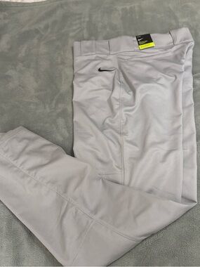 Nike Men’s Light Gray baseball pants with Black Swoosh